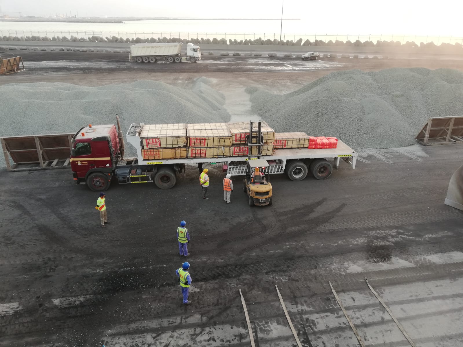 Trucks, personnel and bulk cargo at the quayside