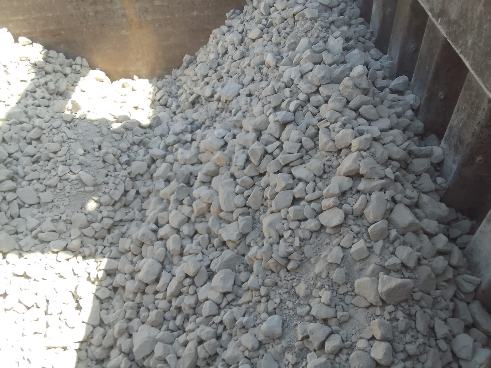 Rock cargo within a vessel hold, seen from above